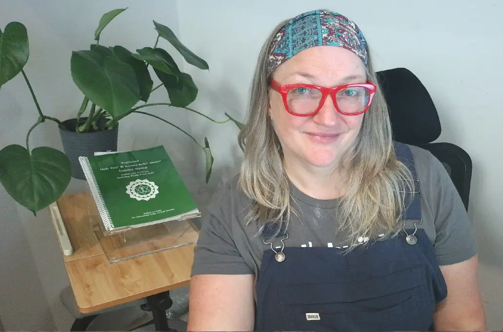 Judy with her Karuna Reiki Master training manual